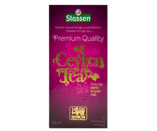 STASSEN Herbata - Premium Quality Ceylon Tea - ozdobne opakowanie ze złotym akcentem z czarną cejlońską herbatą.