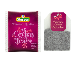 STASSEN Herbata - Premium Quality Ceylon Tea - ozdobne opakowanie ze złotym akcentem z czarną cejlońską herbatą.